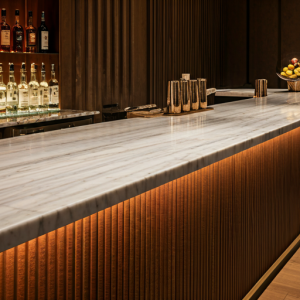 Bar counter design with Carrara marble juxtaposed with Rosso Verona marble.