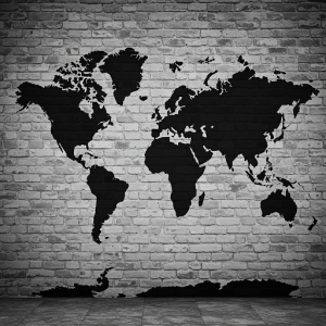 Black World Map on White Brick Background: A black map printed over a photorealistic black and white brick wall design for an industrial chic vibe.