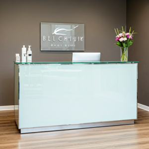 Beauty and hair salon reception desk sophisticated and luxurious feel make from glass and metal.