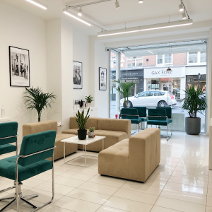 Salon waiting room mix of individual chairs and small sofas to accommodate different group sizes and preferences.