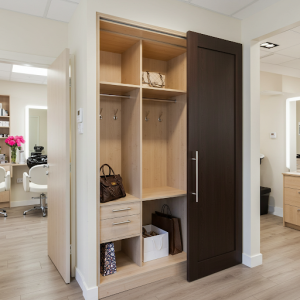 The salon closet discreetly tucked away from the main waiting area allows clients to access their belongings and store coats or bags without intruding on the salon's workspace.