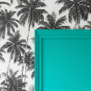 Vibrant turquoise complements the black and white palm tree wallpaper mural.