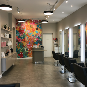 Beauty salon renovation with reception mural.