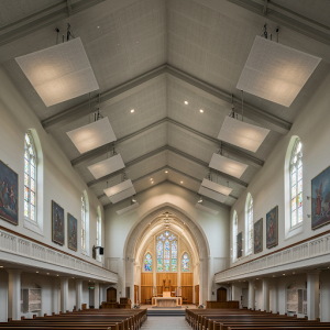 In high-ceilinged churches, ceiling clouds, suspended panels that absorb sound, are also essential. 