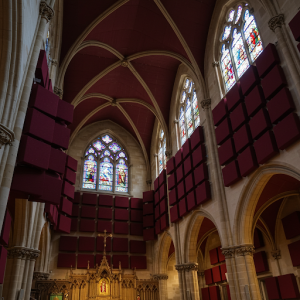 Install fabric-wrapped sound-absorbing panels on church walls and ceilings. These are highly effective in reducing sound reflections that cause echo.