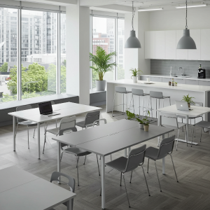 Modular tables and chairs allow the office kitchen dining to be reconfigured according to needs.