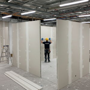 Plasterboard absorbs sound transmission between rooms as it absorbs and attenuates noise. It is used in the construction of meeting room partition walls. 