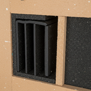 Rubber sheets are installed within wall cavities to reduce airborne noise transmission.