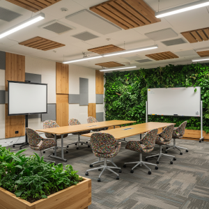 Meeting room acoustics with a combination of biophilic elements and traditional soundproofing.