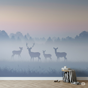 a mural depicting soft silhouettes of deer against a misty dawn backdrop