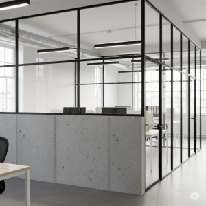 A concrete half-wall paired with black-framed, clear glass panels, an urban loft office partition.