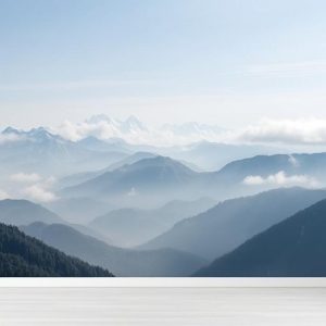 Misty Mountain Range Customized Wallpaper Mural. A serene, panoramic view of snow-capped peaks shrouded in mist.