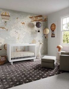 Kindergarten wallpaper mural features a world map which includes labels of oceans, as well as a compass rose.